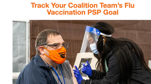 A team member receives a flu shot