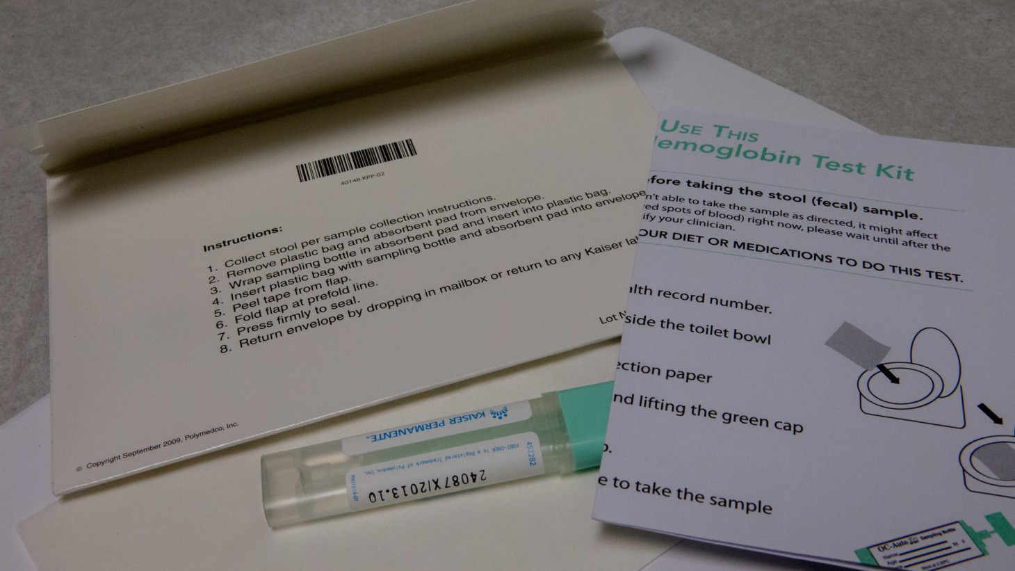 Envelope, test tube and instructions for a FIT kit 