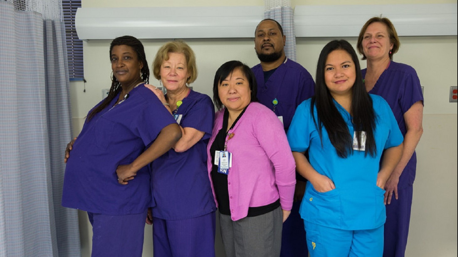 six health care workers posing in a group photo